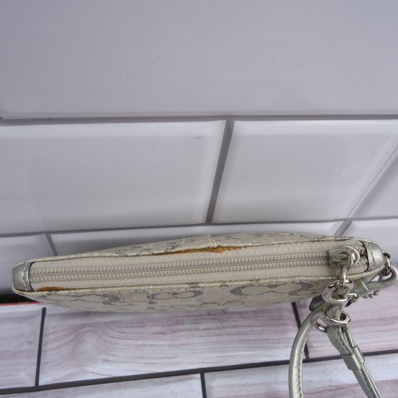 Coach wristlet with classic signature print canvas. - Picture 8 of 16